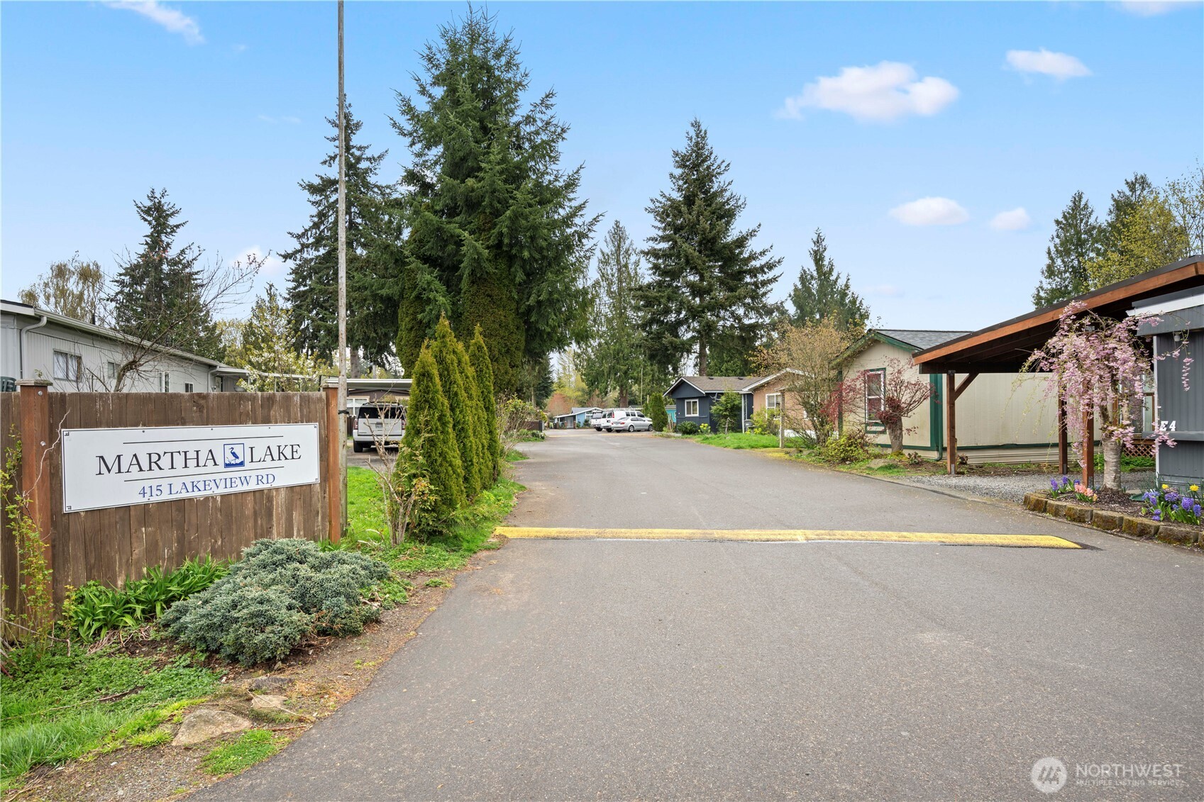 415 Lakeview Road, Unit K35 Lynnwood, WA 98087 - Photo 4 of 27 a street sign on a sidewalk next to a road