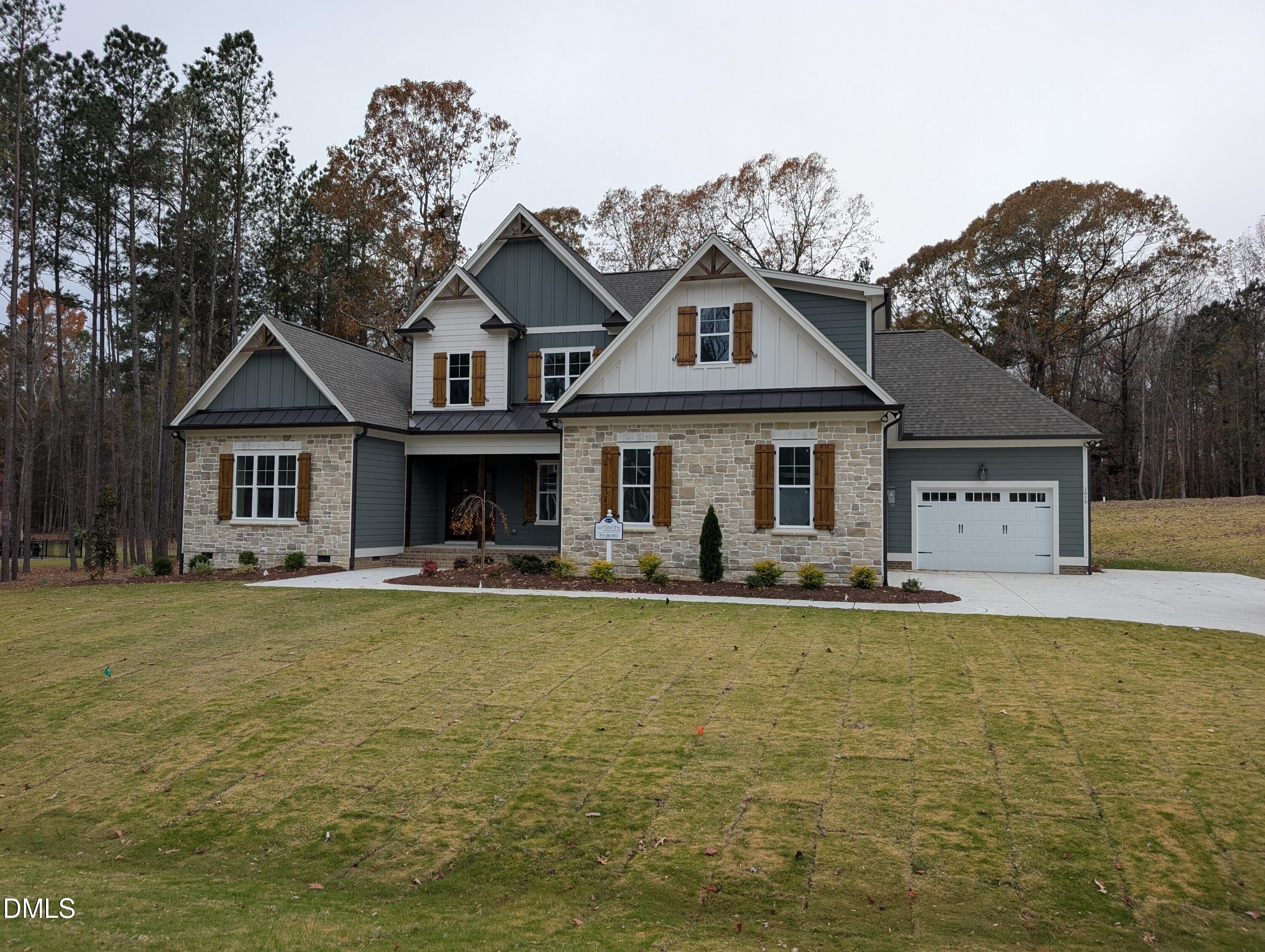 1616 River Bend Lane Raleigh, NC 27610 - Photo 2 of 54 a front view of a house with garden