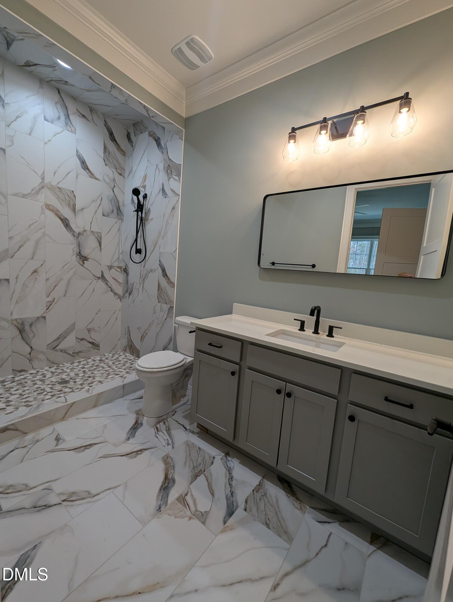 1616 River Bend Lane Raleigh, NC 27610 - Photo 33 of 54 a bathroom with a double vanity sink mirror and toilet
