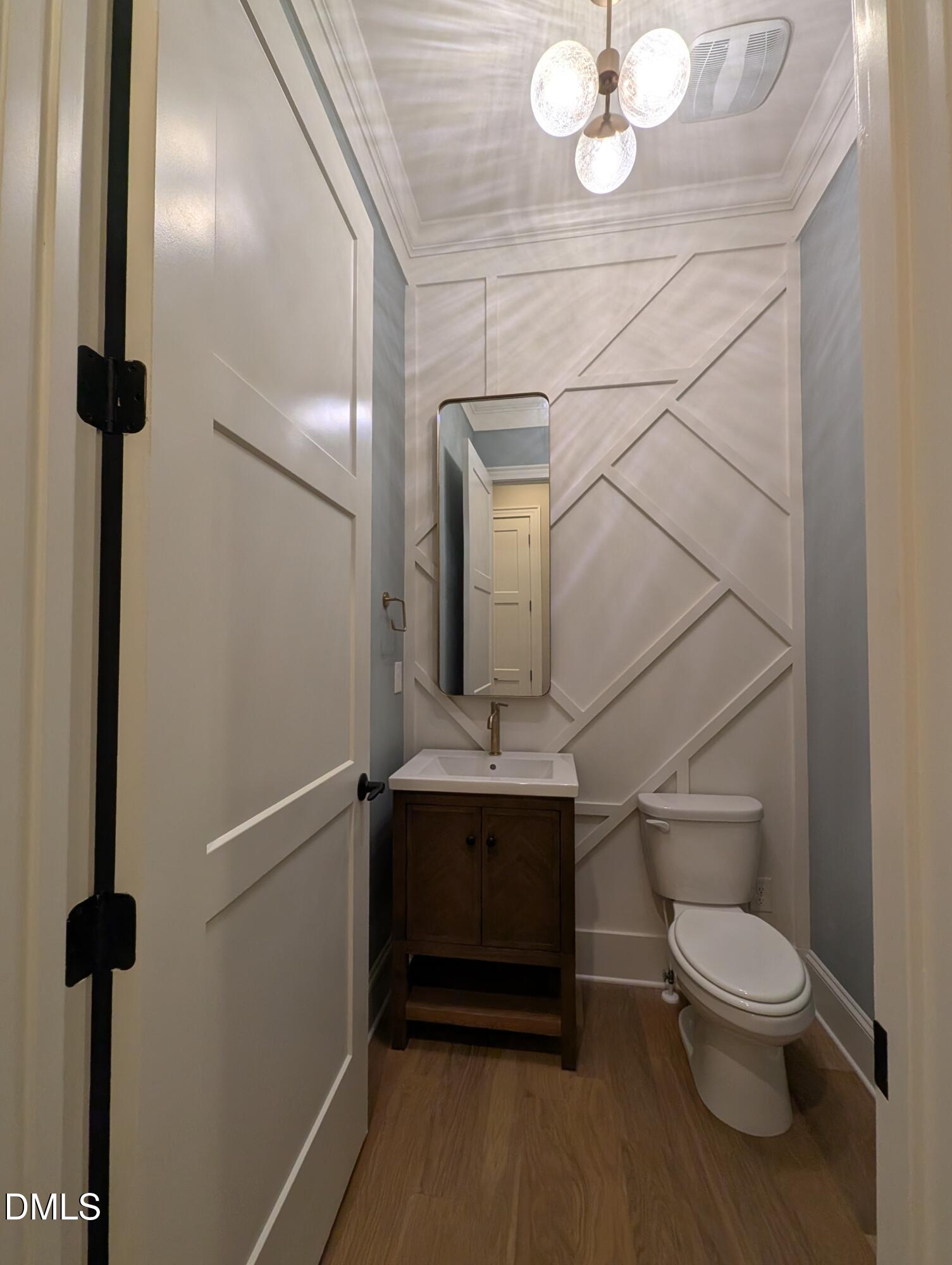 1616 River Bend Lane Raleigh, NC 27610 - Photo 35 of 54 a bathroom with a toilet a sink and mirror