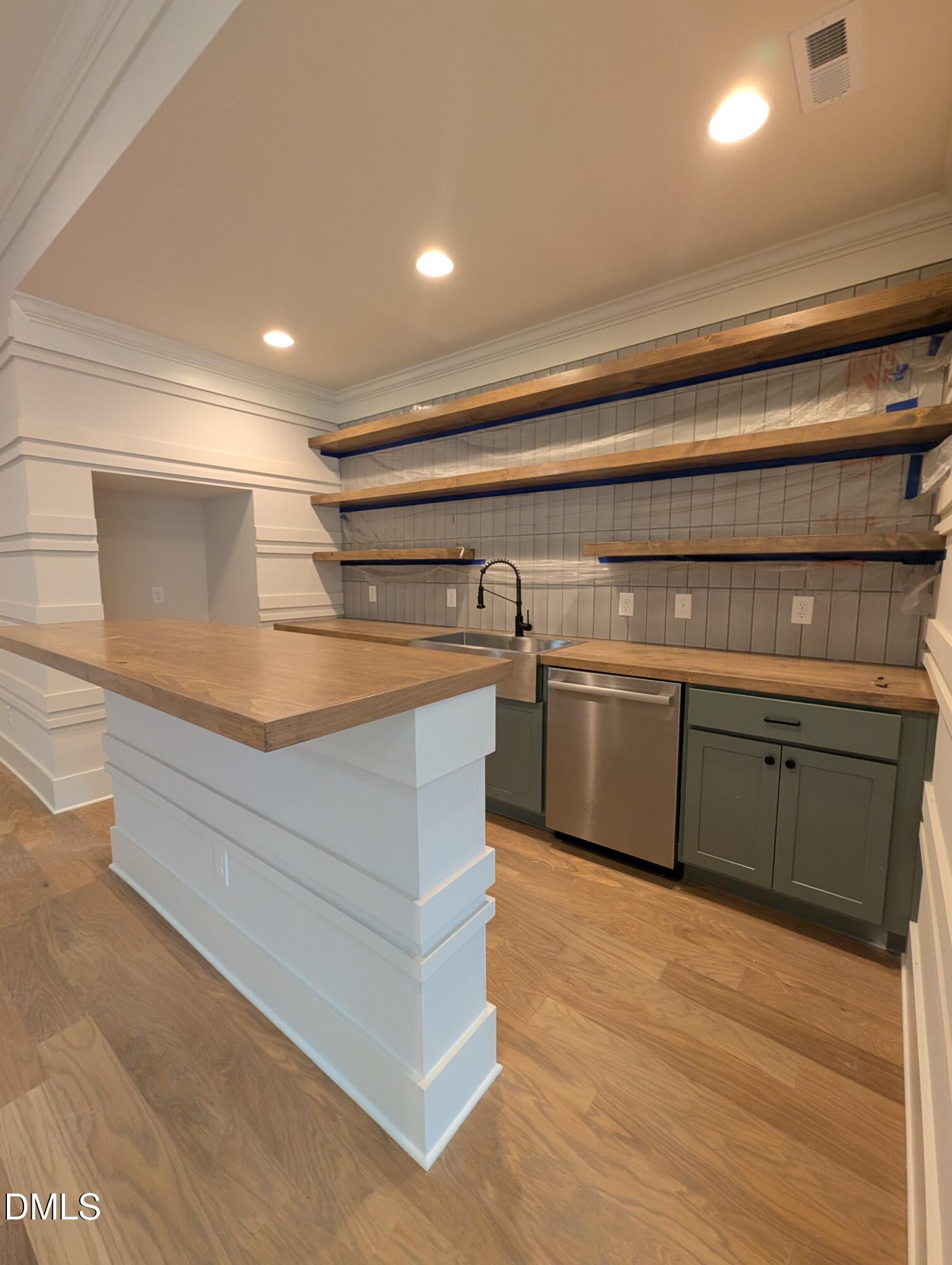 1616 River Bend Lane Raleigh, NC 27610 - Photo 39 of 54 a kitchen with stainless steel appliances granite countertop a sink and cabinets