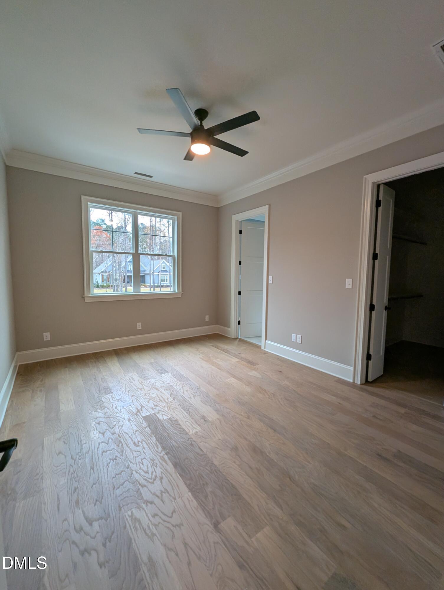 1616 River Bend Lane Raleigh, NC 27610 - Photo 42 of 54 a view of an empty room with wooden floor and a window