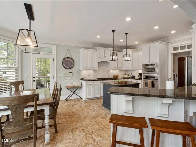 a living room with furniture and a clock