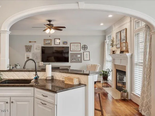 a dining table with chairs and window
