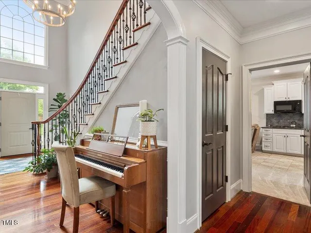 a kitchen with granite countertop a sink a stove and cabinets