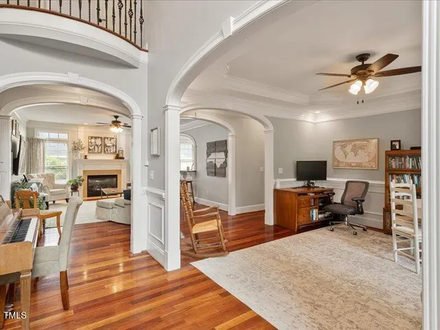 a view of entryway and hall with wooden floor