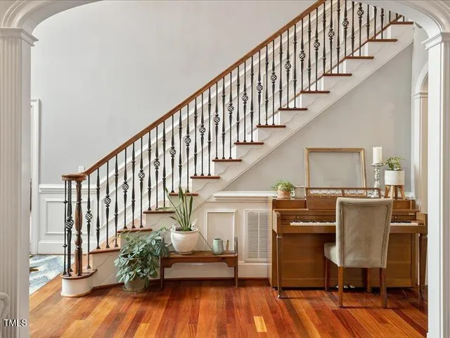 a living room with furniture and a dining table