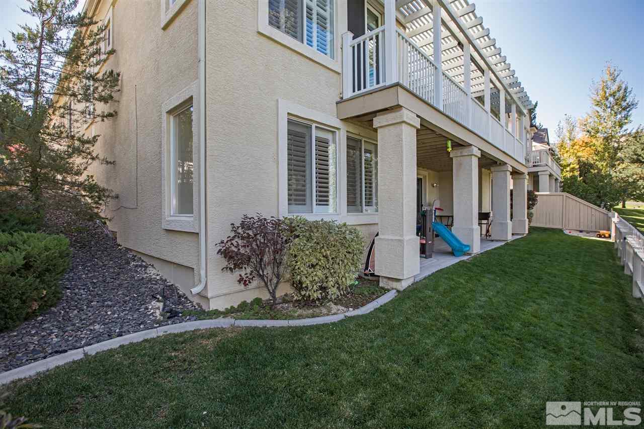 1775 Caughlin Creek Road Reno, NV 89519 - Photo 25 of 25 a view of a house with brick walls and a yard with plants