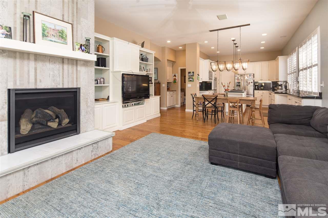 1775 Caughlin Creek Road Reno, NV 89519 - Photo 7 of 25 a living room with furniture a flat screen tv and a fireplace