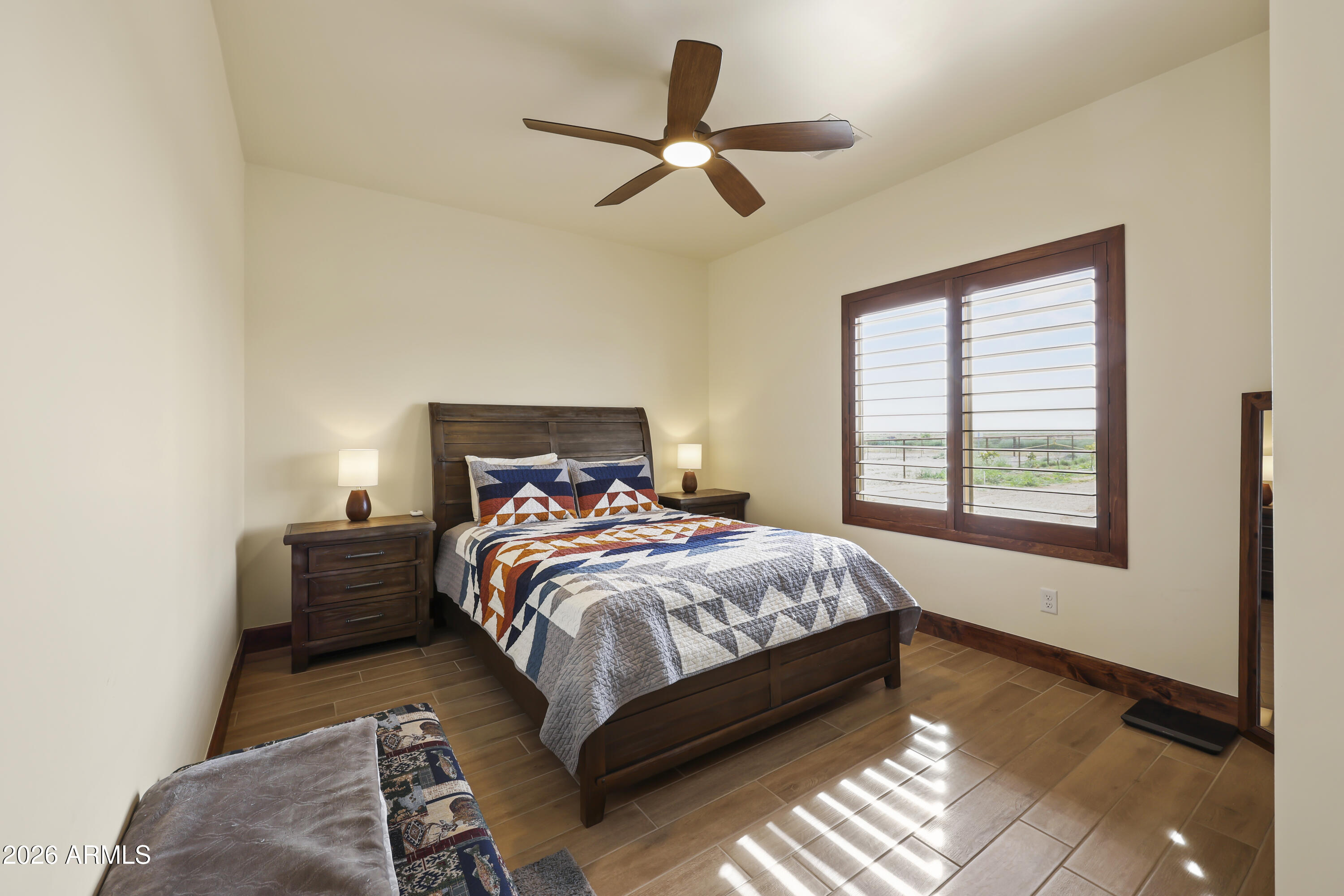 49370 West Val Vista Road Maricopa, AZ 85139 - Photo 11 of 58 a bedroom with a bed furniture and a window