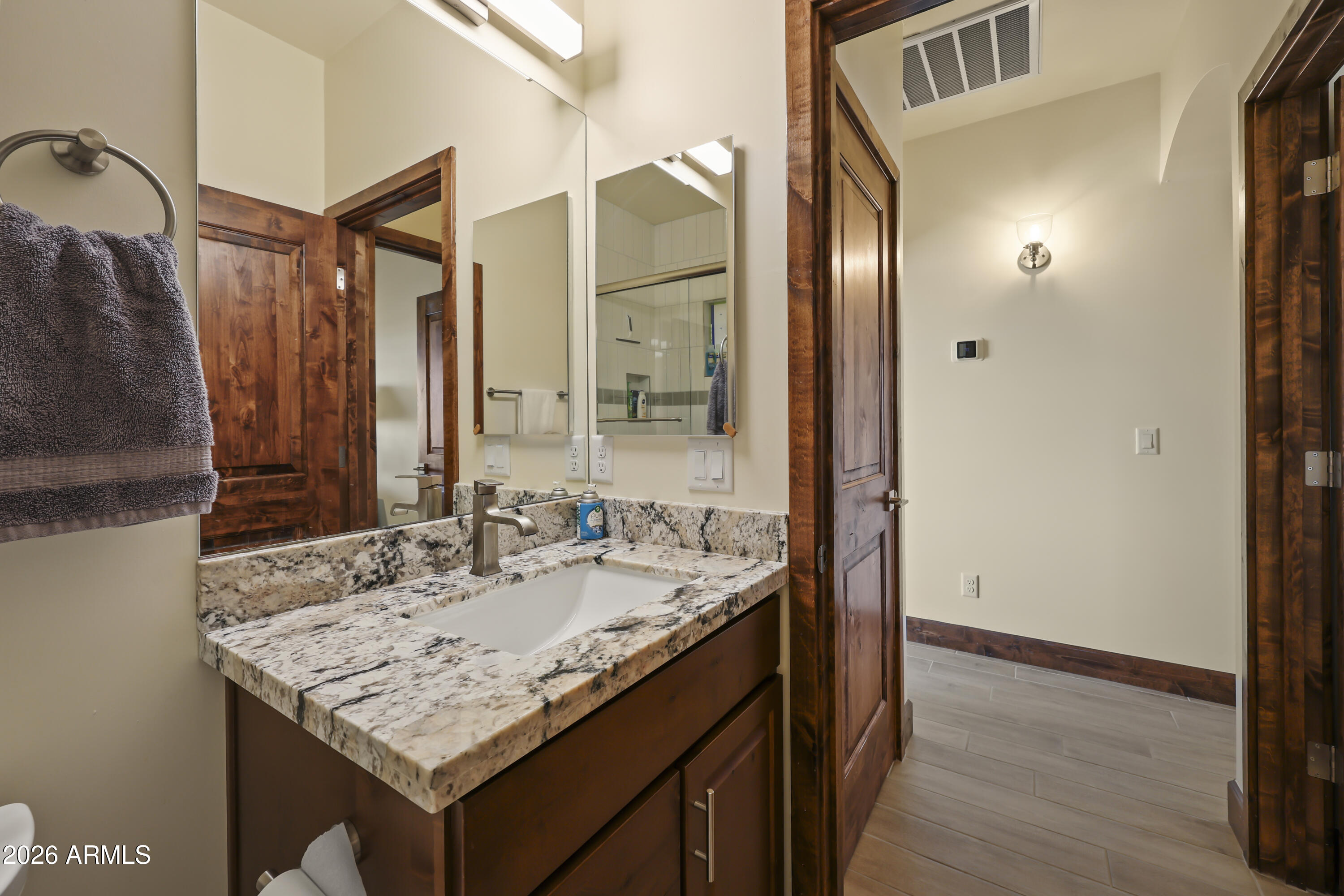 49370 West Val Vista Road Maricopa, AZ 85139 - Photo 16 of 58 a bathroom with a granite countertop sink and a mirror