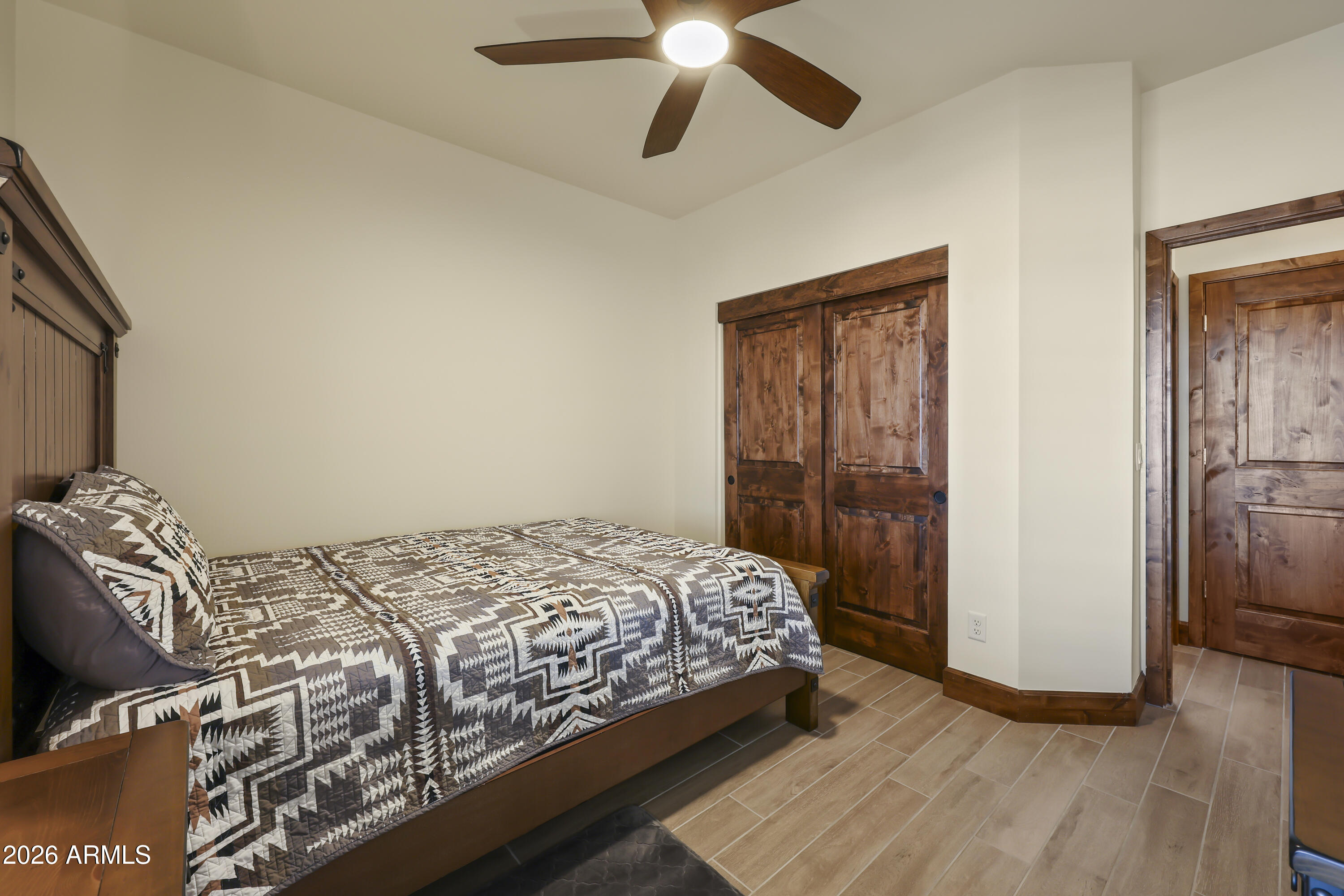 49370 West Val Vista Road Maricopa, AZ 85139 - Photo 18 of 58 a bedroom with a bed and a window