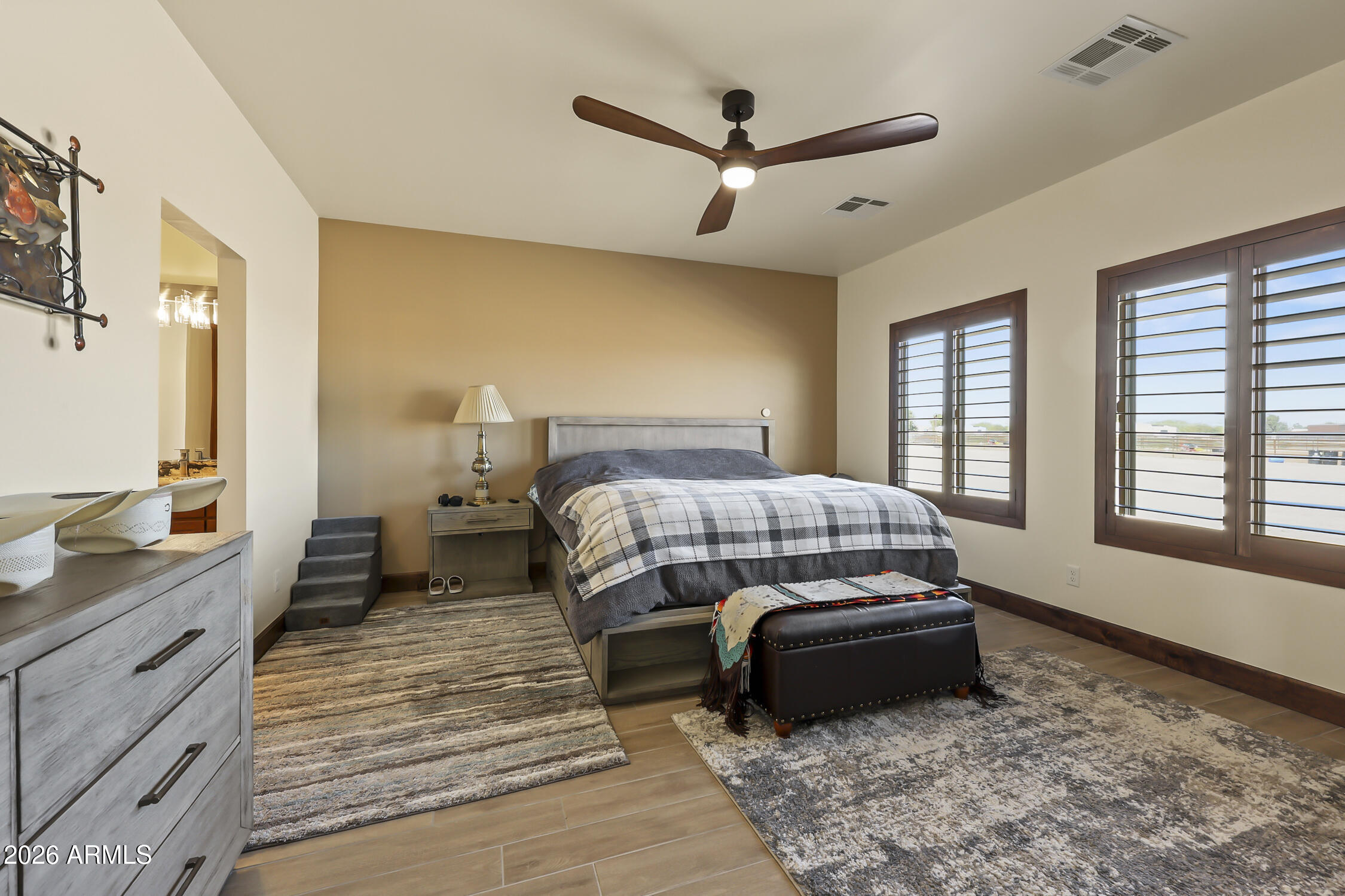 49370 West Val Vista Road Maricopa, AZ 85139 - Photo 23 of 58 a bedroom with a bed and a dresser