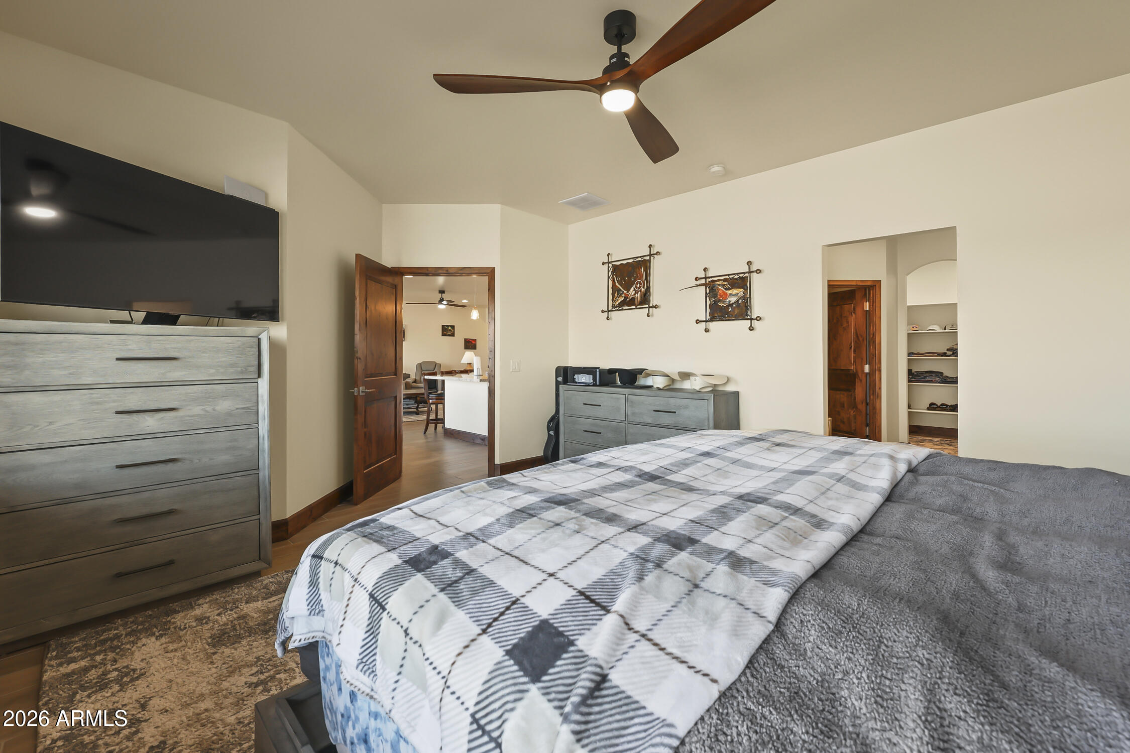 49370 West Val Vista Road Maricopa, AZ 85139 - Photo 24 of 58 a bedroom with a bed and a flat screen tv