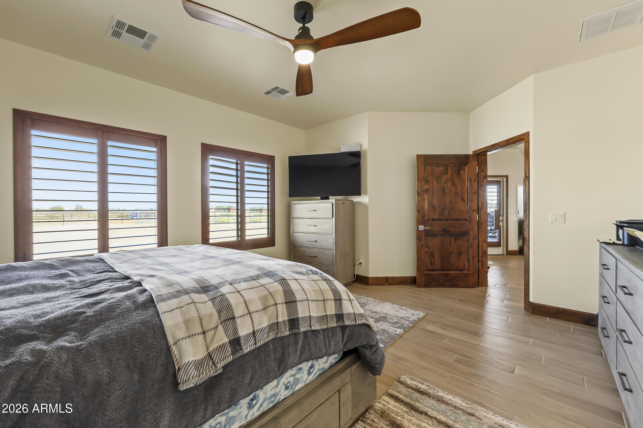 49370 West Val Vista Road Maricopa, AZ 85139 - Photo 25 of 58 a bedroom with a bed and a refrigerator