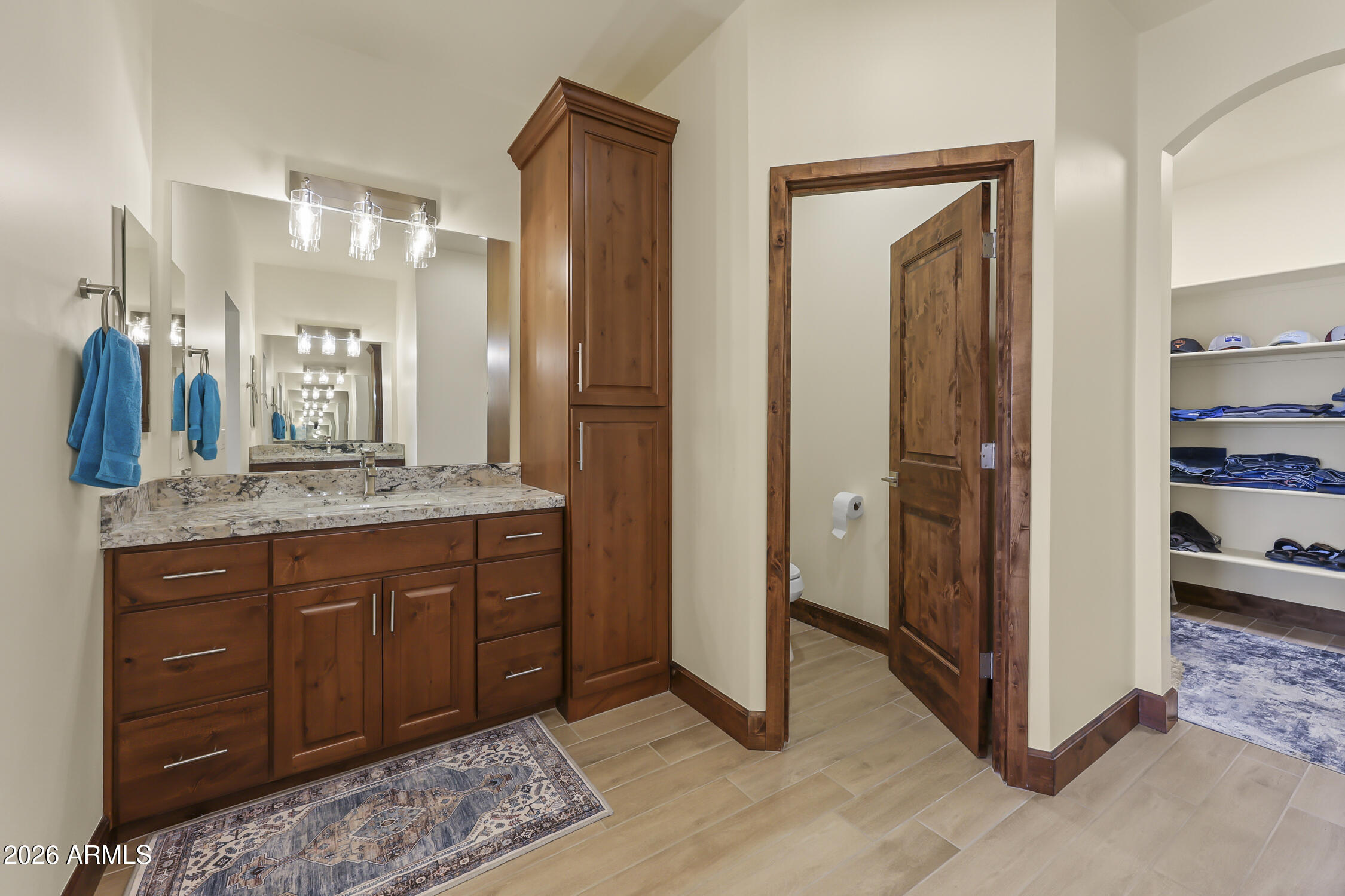 49370 West Val Vista Road Maricopa, AZ 85139 - Photo 27 of 58 a spacious bathroom with a granite countertop sink and a mirror