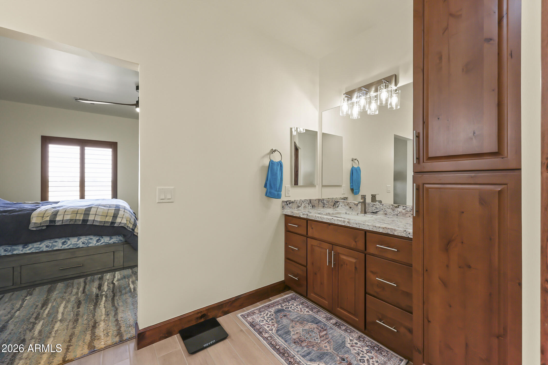 49370 West Val Vista Road Maricopa, AZ 85139 - Photo 30 of 58 a bathroom with a granite countertop sink and a mirror