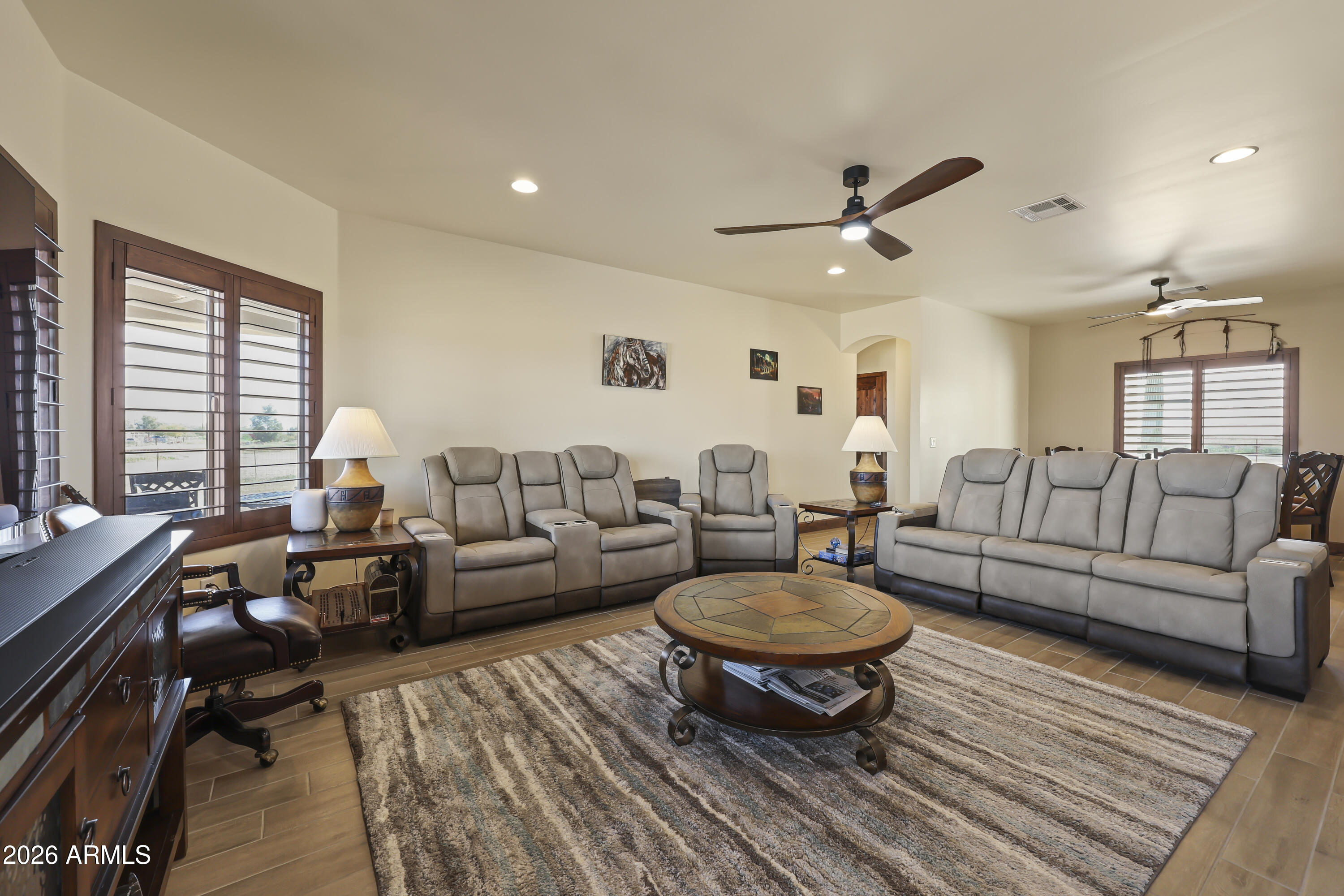 49370 West Val Vista Road Maricopa, AZ 85139 - Photo 4 of 58 a living room with furniture a rug and a large window