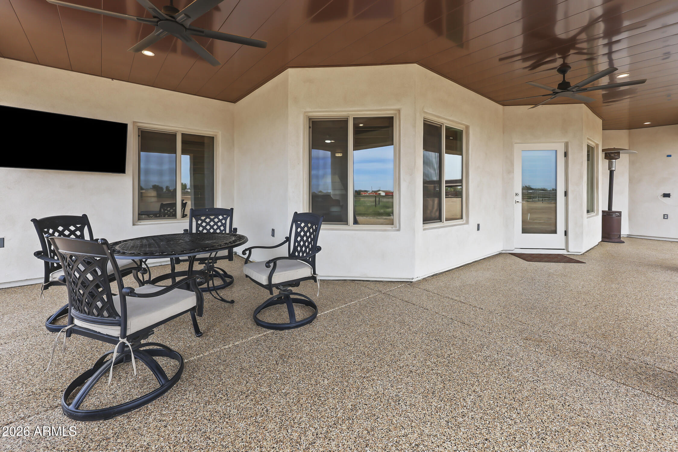 49370 West Val Vista Road Maricopa, AZ 85139 - Photo 46 of 58 a view of a livingroom with furniture and a flat screen tv