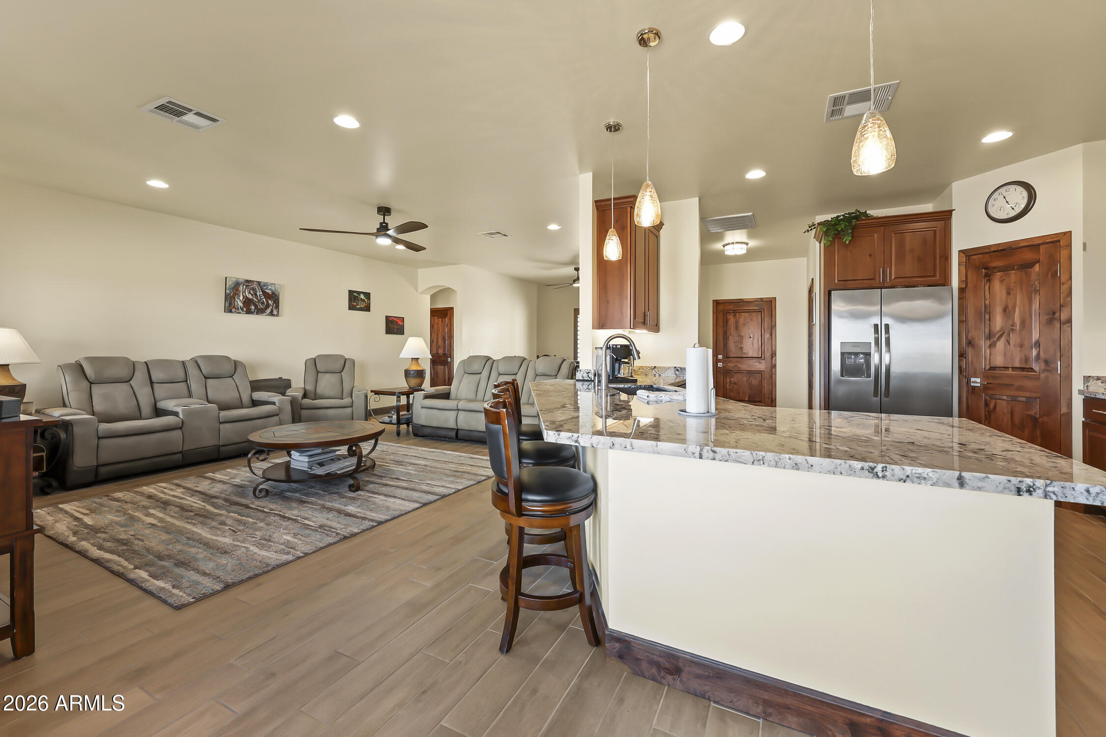 49370 West Val Vista Road Maricopa, AZ 85139 - Photo 8 of 58 a living room with lots of furniture and kitchen view