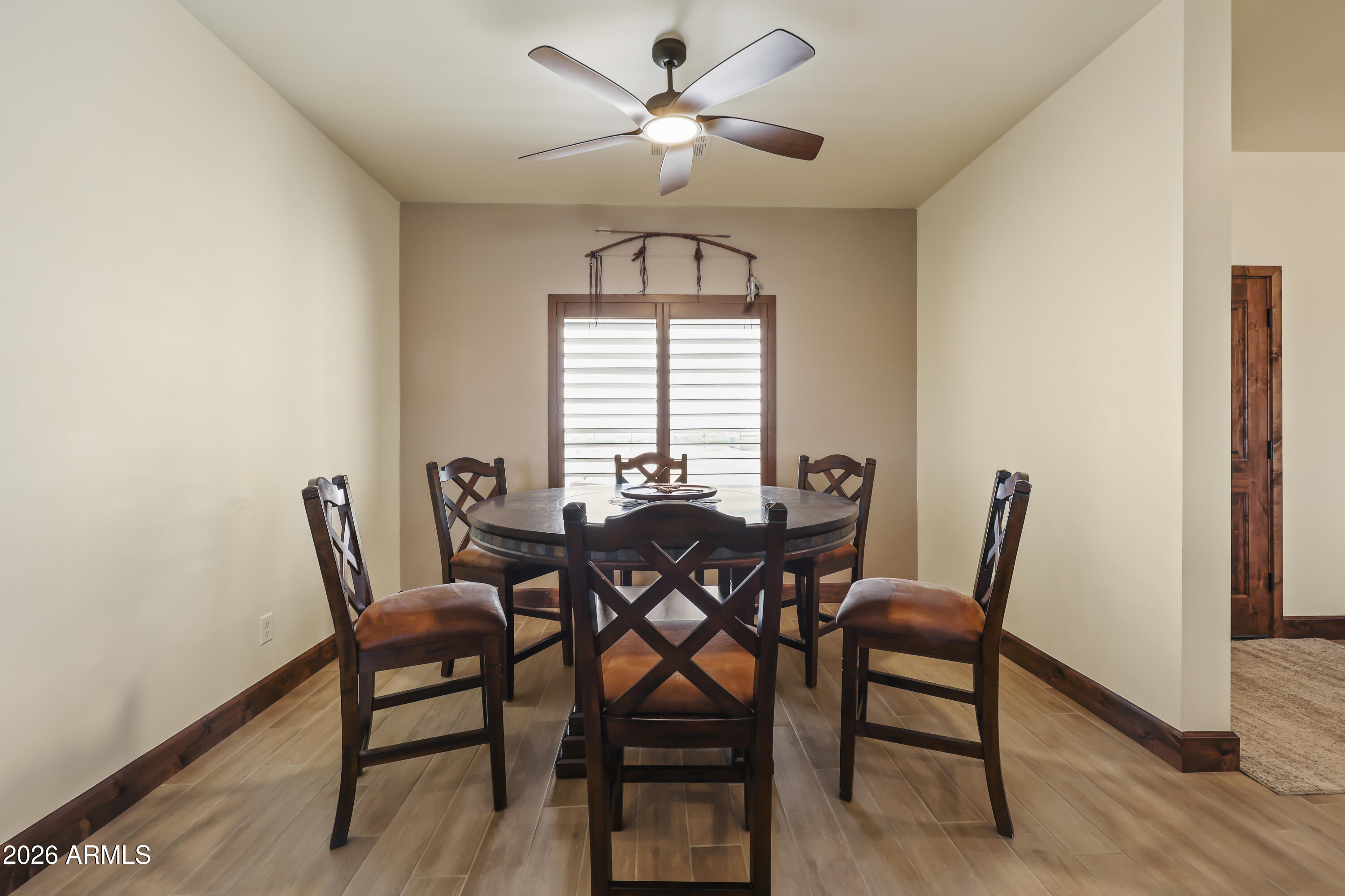 49370 West Val Vista Road Maricopa, AZ 85139 - Photo 10 of 58 a view of a dining room with furniture and a chandelier