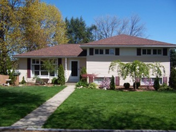 67 Dayton Street Springfield, MA 01118 - Photo 1 of 20 a front view of a house with a garden
