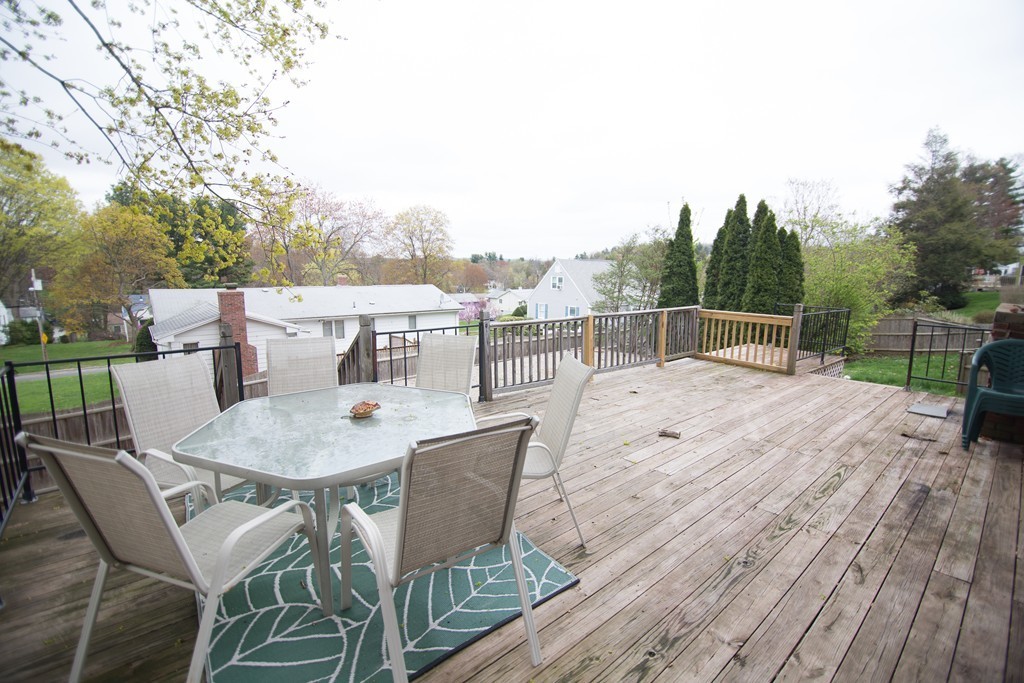 67 Dayton Street Springfield, MA 01118 - Photo 17 of 20 a terrace with a table and chairs