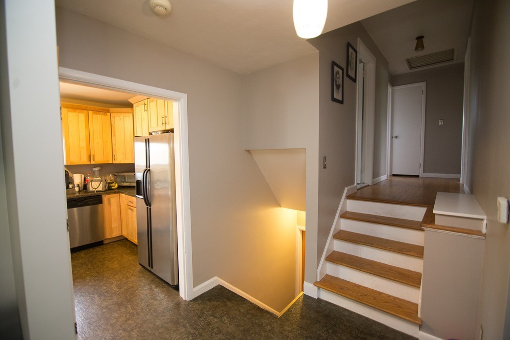 67 Dayton Street Springfield, MA 01118 - Photo 7 of 20 a view of a kitchen with a sink and refrigerator