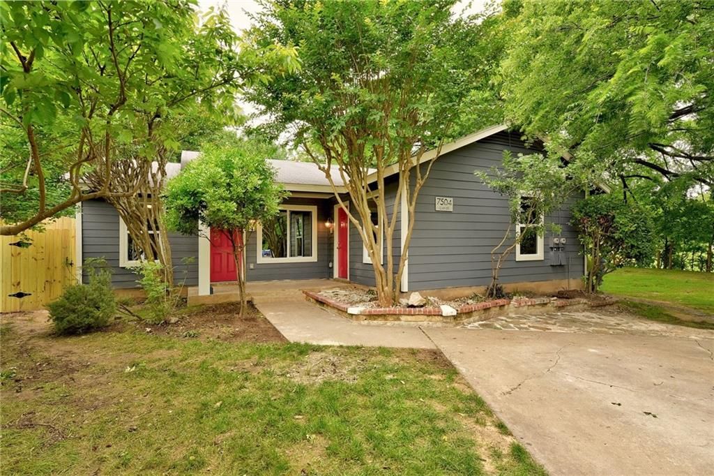 7504 Carver Avenue, Unit A Austin, TX 78752 - Photo 1 of 11 a front view of a house with a yard