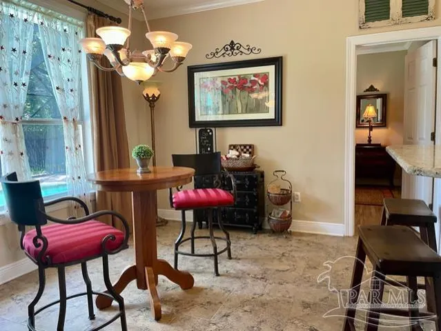 a view of a dining room with furniture window and outside view