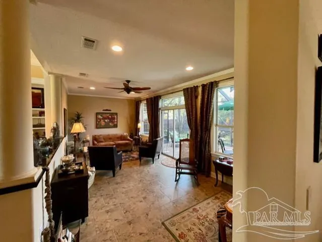 a bed room with furniture and a flat screen tv