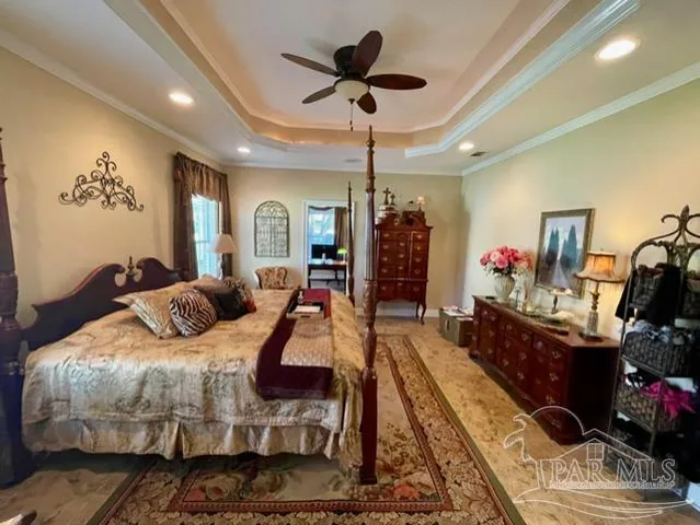 a bed room with a bed window and a dresser