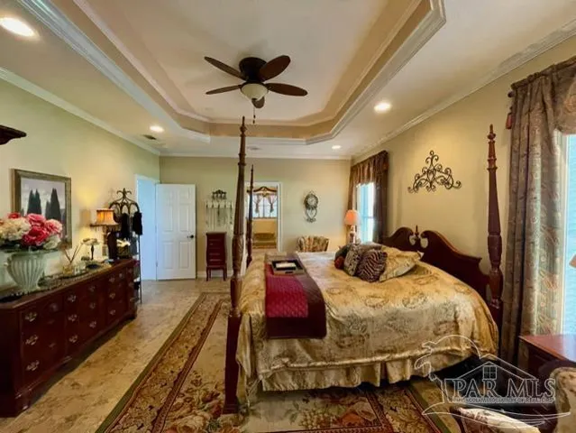 a view of a livingroom with furniture and a mirror