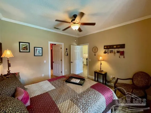 a bedroom with bed and a window