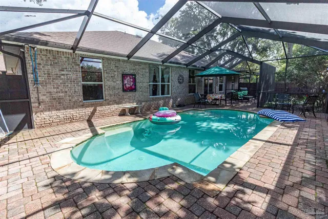 a backyard of a house with outdoor seating