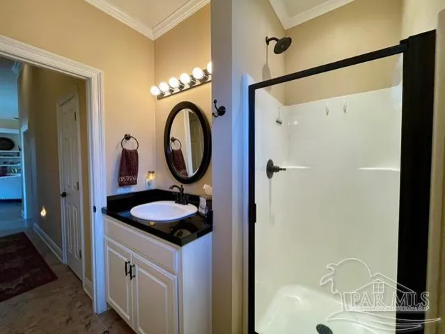 a view of a chair and tables in backyard of the house