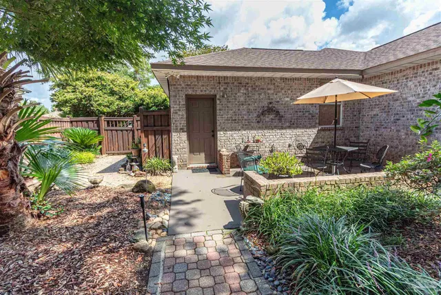 a chair and table in a backyard