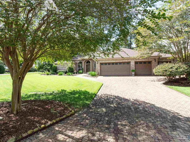 swimming pool view with a seating space and a garden view