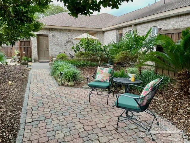 a living room with lots of furniture and a chandelier