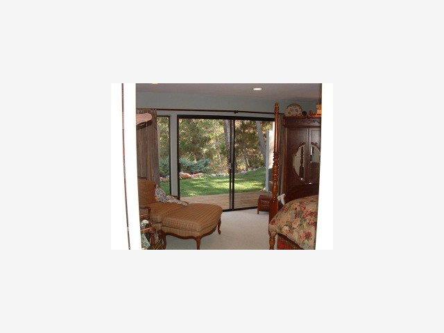 25435 Hidden Mesa Road Monterey, CA 93940 - Photo 5 of 9 a living room with furniture and a floor to ceiling window