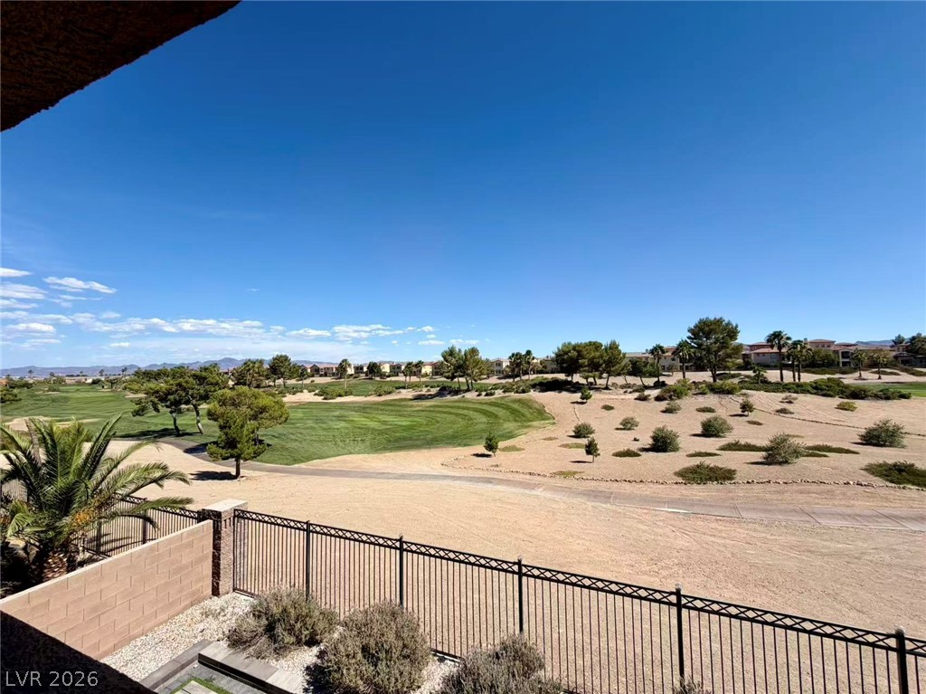 135 Tall Ruff Drive Las Vegas, NV 89148 - Photo 20 of 29 A golfer's paradise awaits with views of lush fairways and mature landscaping under clear skies.