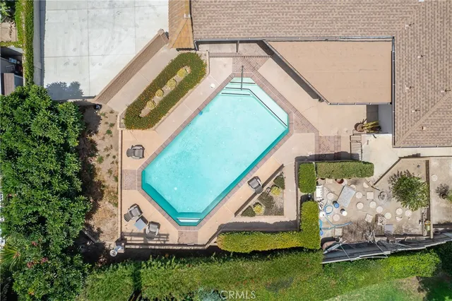 an aerial view of a house with a swimming pool