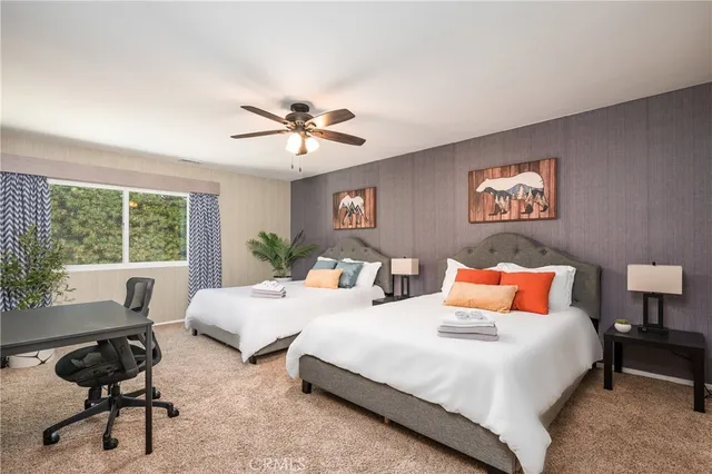 a bedroom with furniture and a window