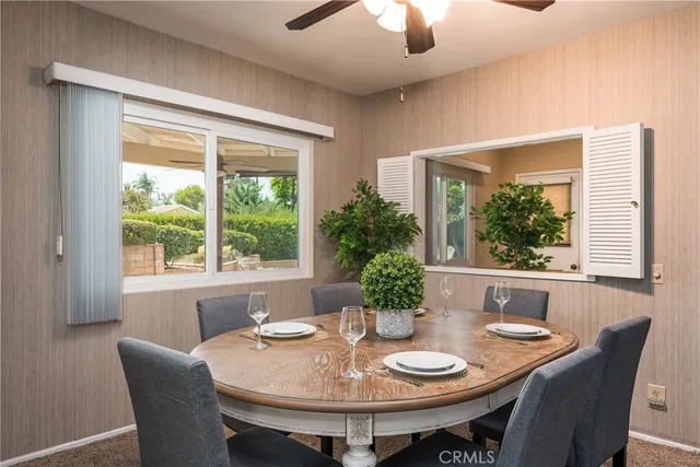 a view of a dining room with furniture window and outside view