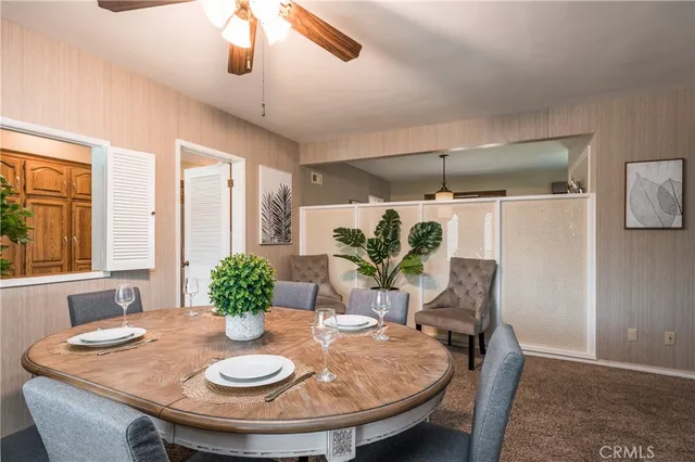 a dining room with furniture and window