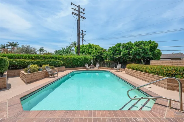 a view of a swimming pool with a patio