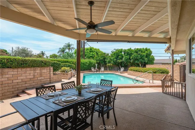 a view of deck with furniture and a backyard