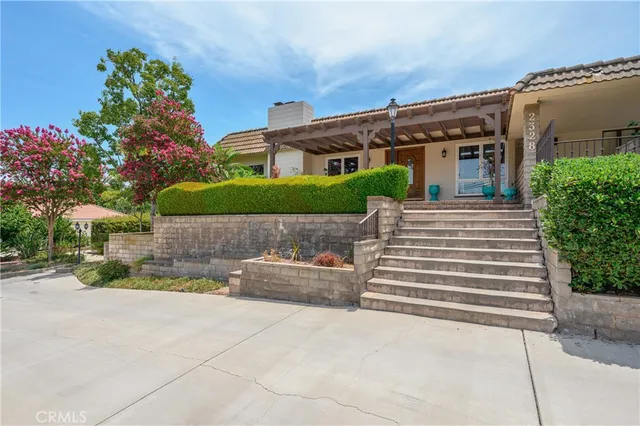 a front view of a house with a yard and a garage