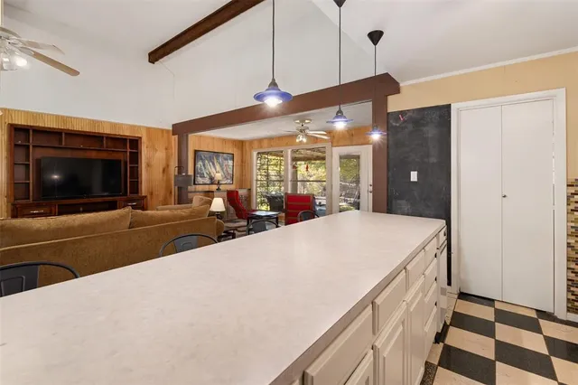 a view of a living room and a flat screen tv