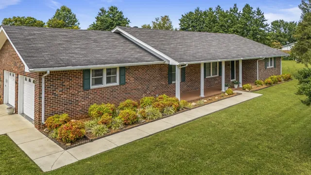 front view of a house with a yard